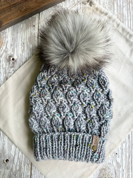 Merino wool knit folded brim beanie with faux fur pom