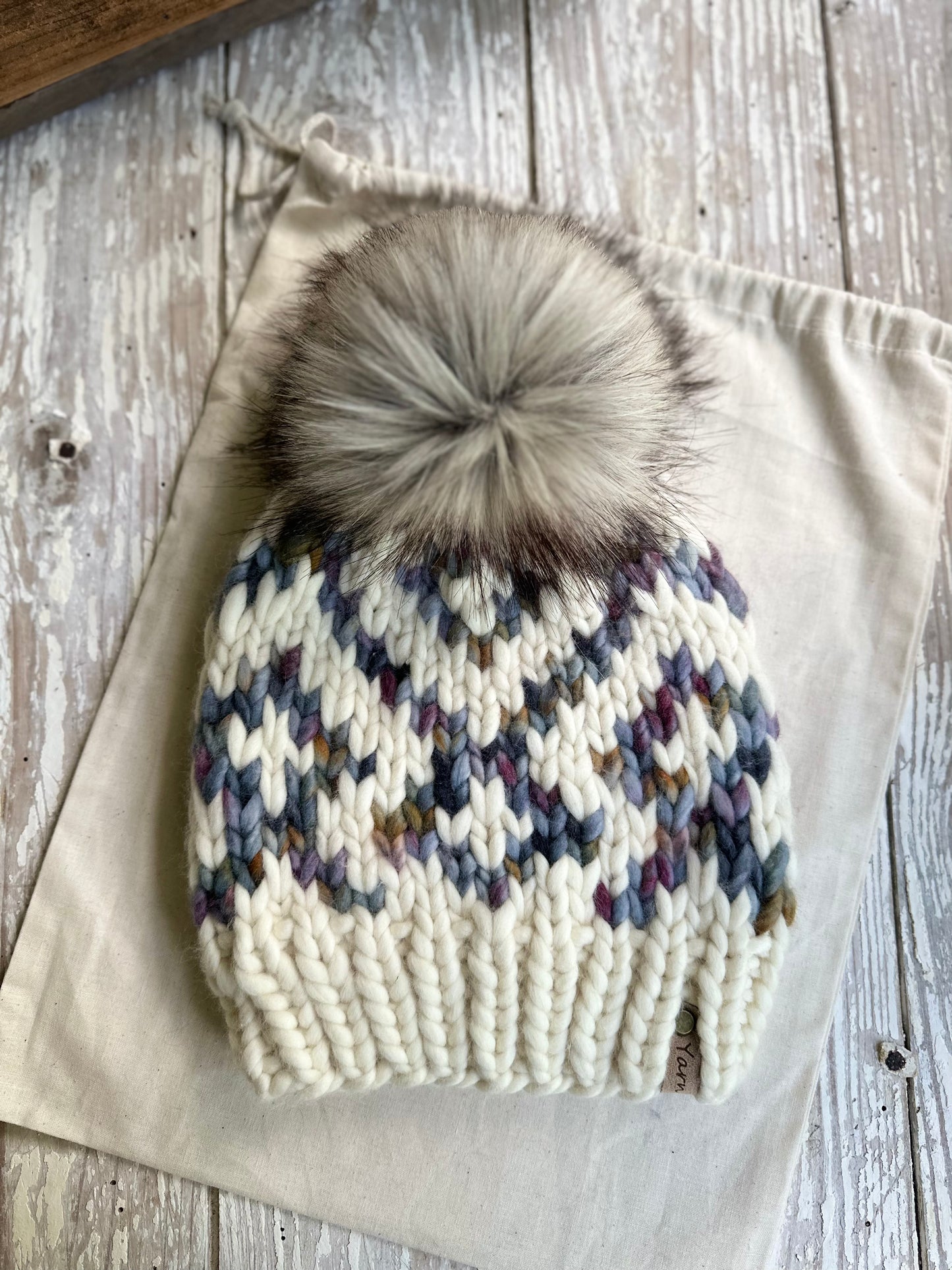 Merino wool knit hat with faux fur Pom