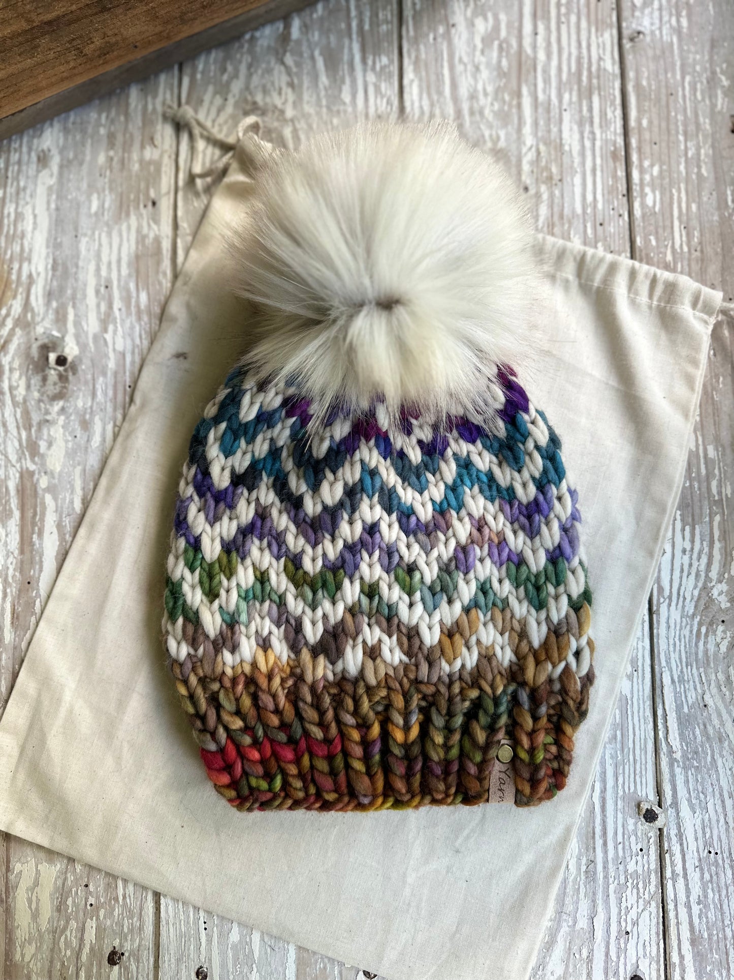 Merino wool knit hat with faux fur Pom