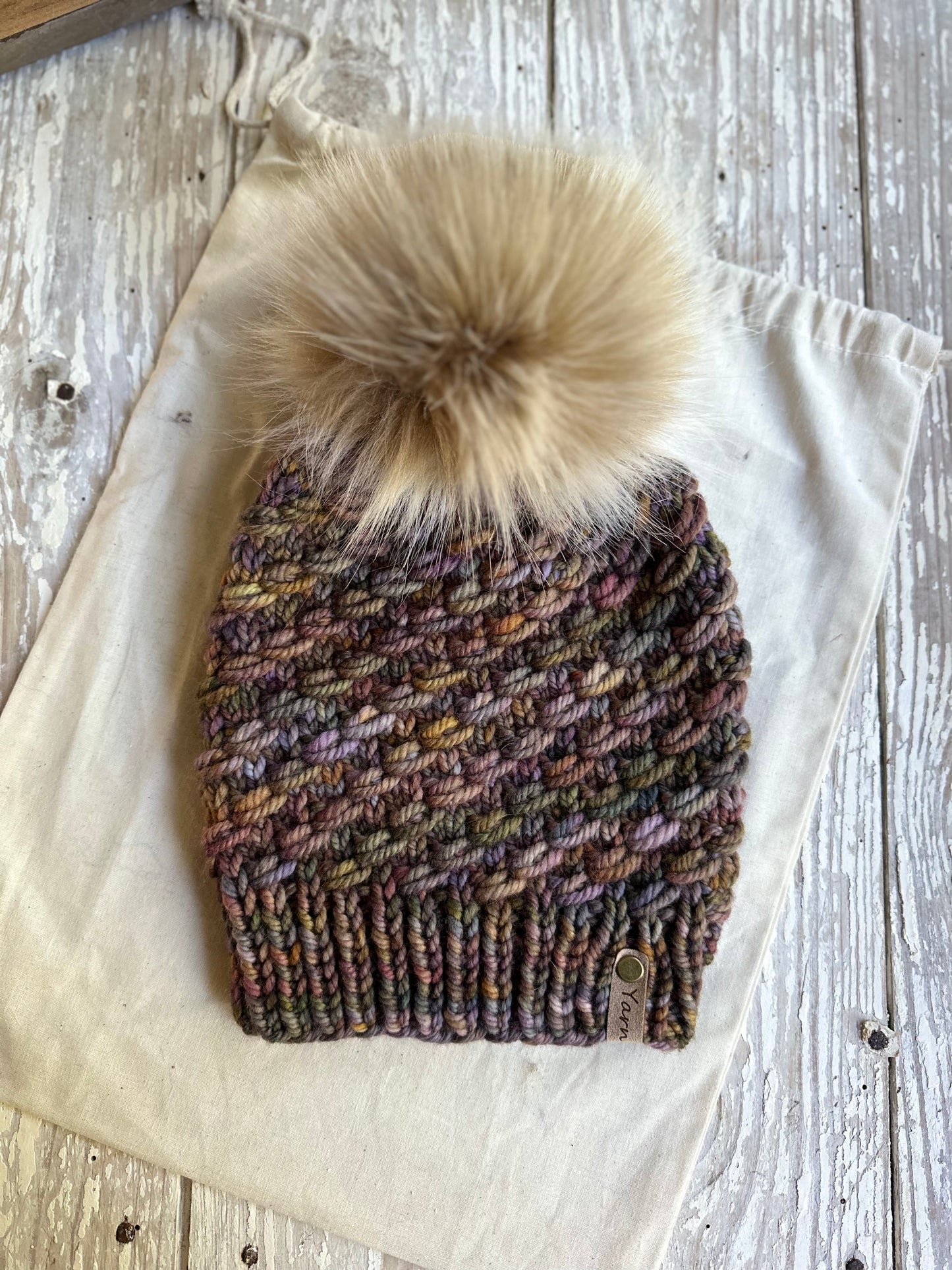 Merino wool knit hat with faux fur Pom