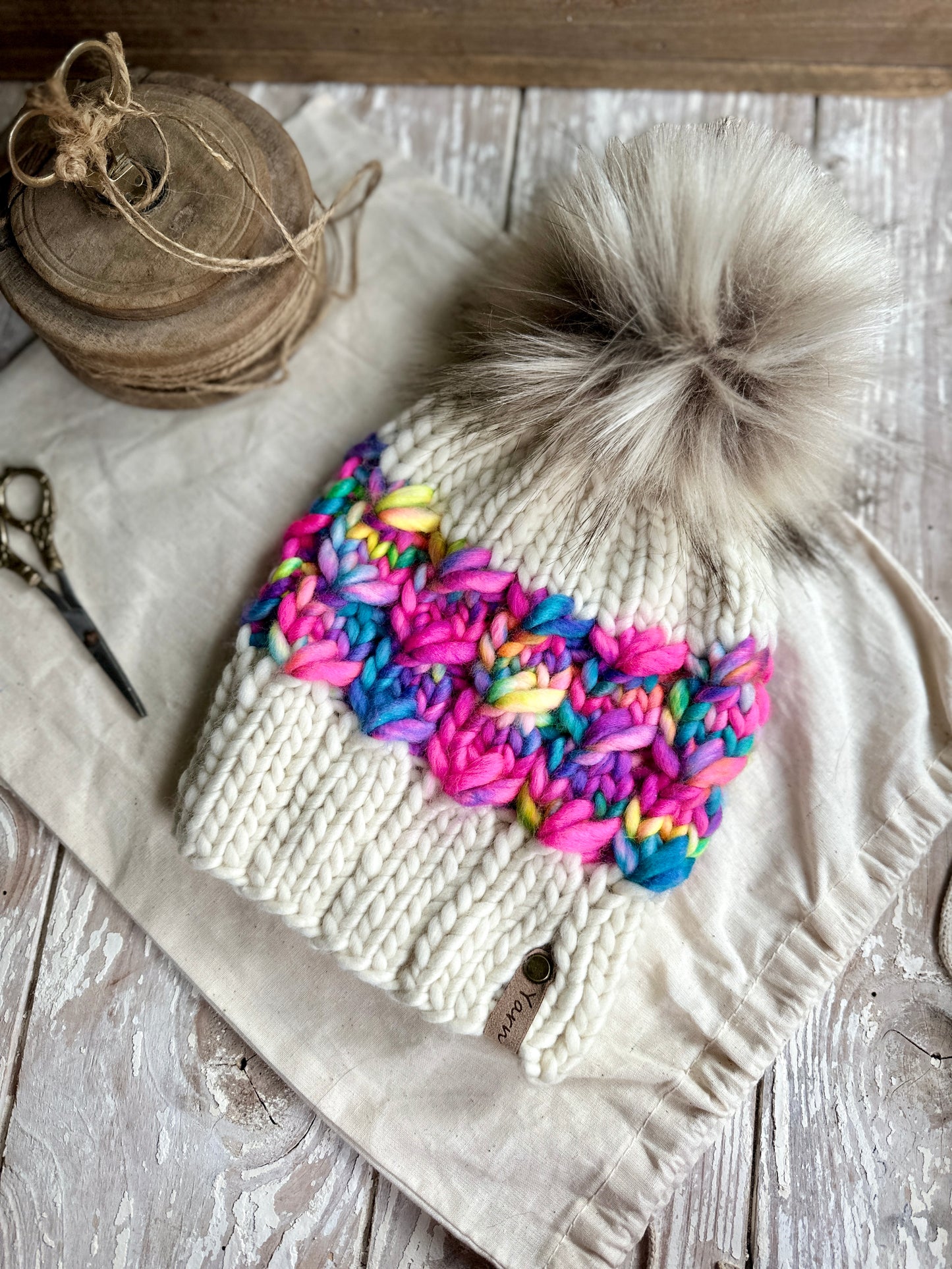 Merino wool knit hat with faux fur Pom