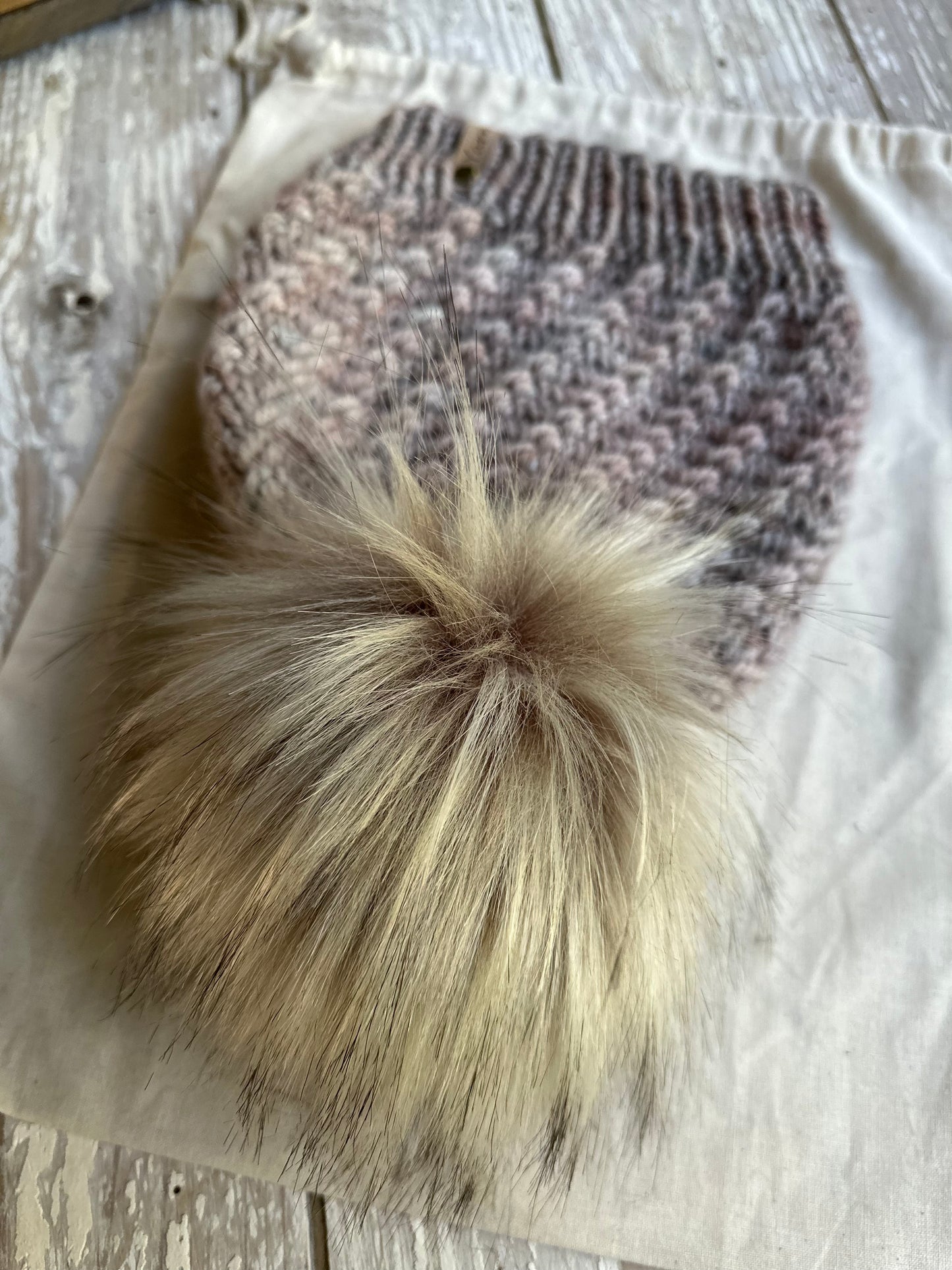 Merino wool knit hat with faux fur pom