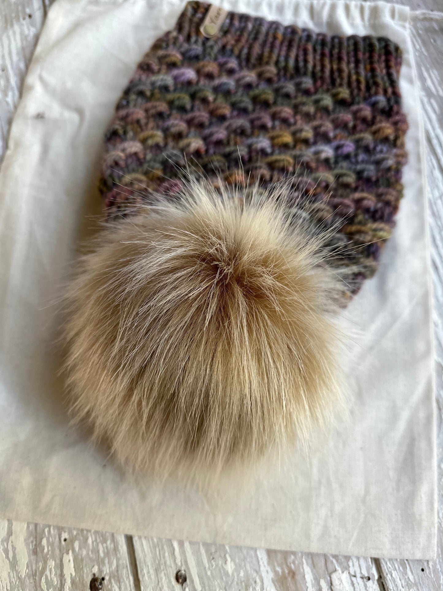 Merino wool knit hat with faux fur Pom