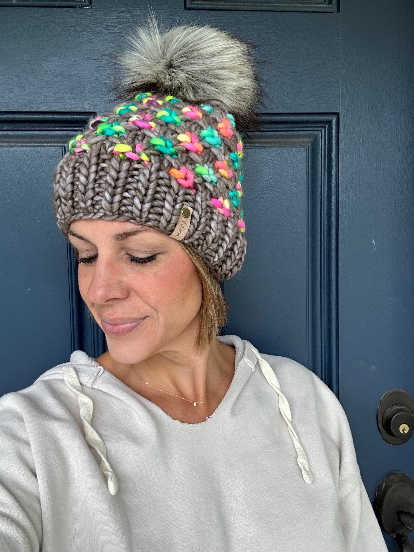 Merino wool knit hat with faux fur pom