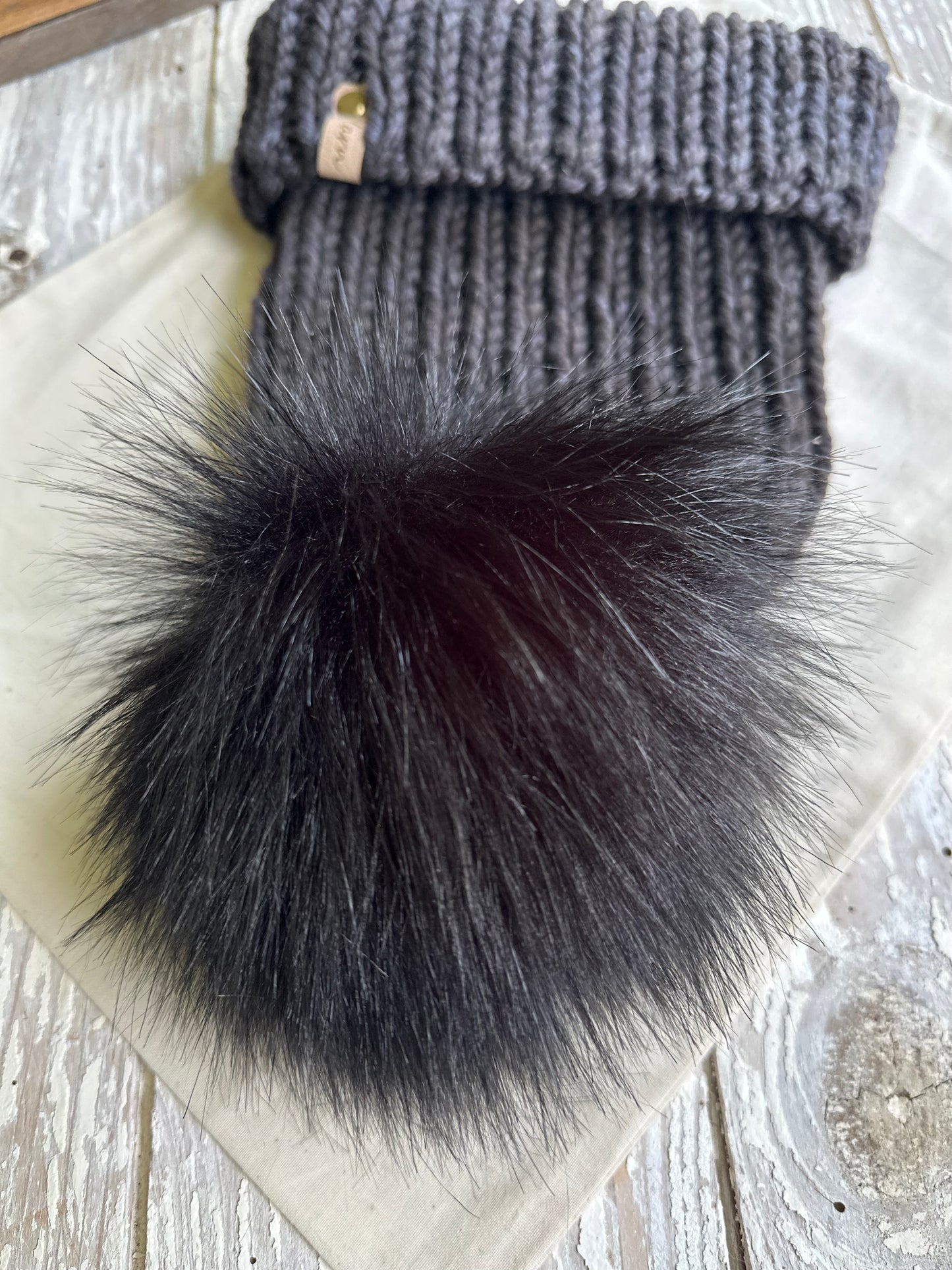 Merino wool knit folded brim beanie with faux fur Pom