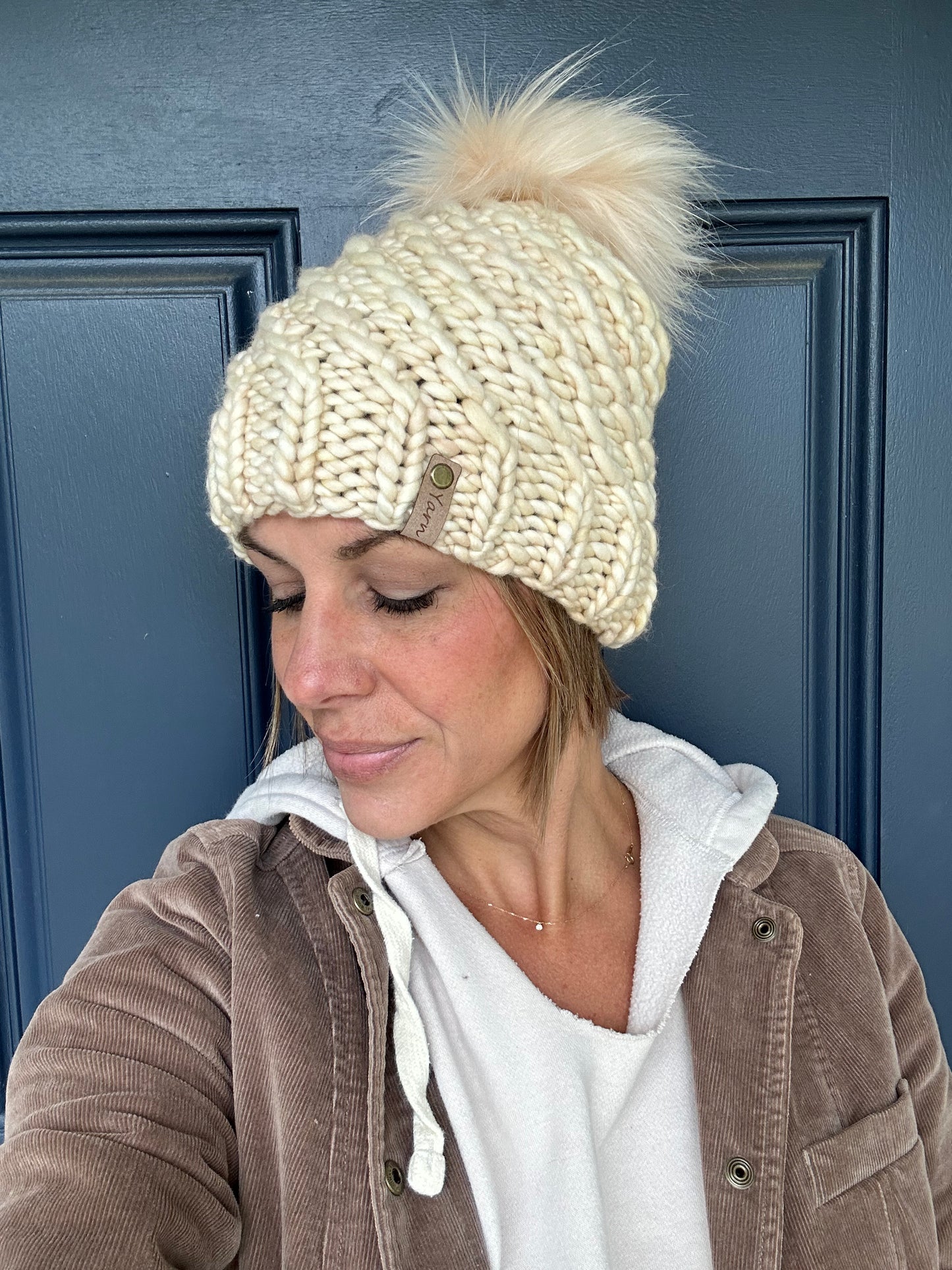 Merino wool knit hat with faux fur Pom