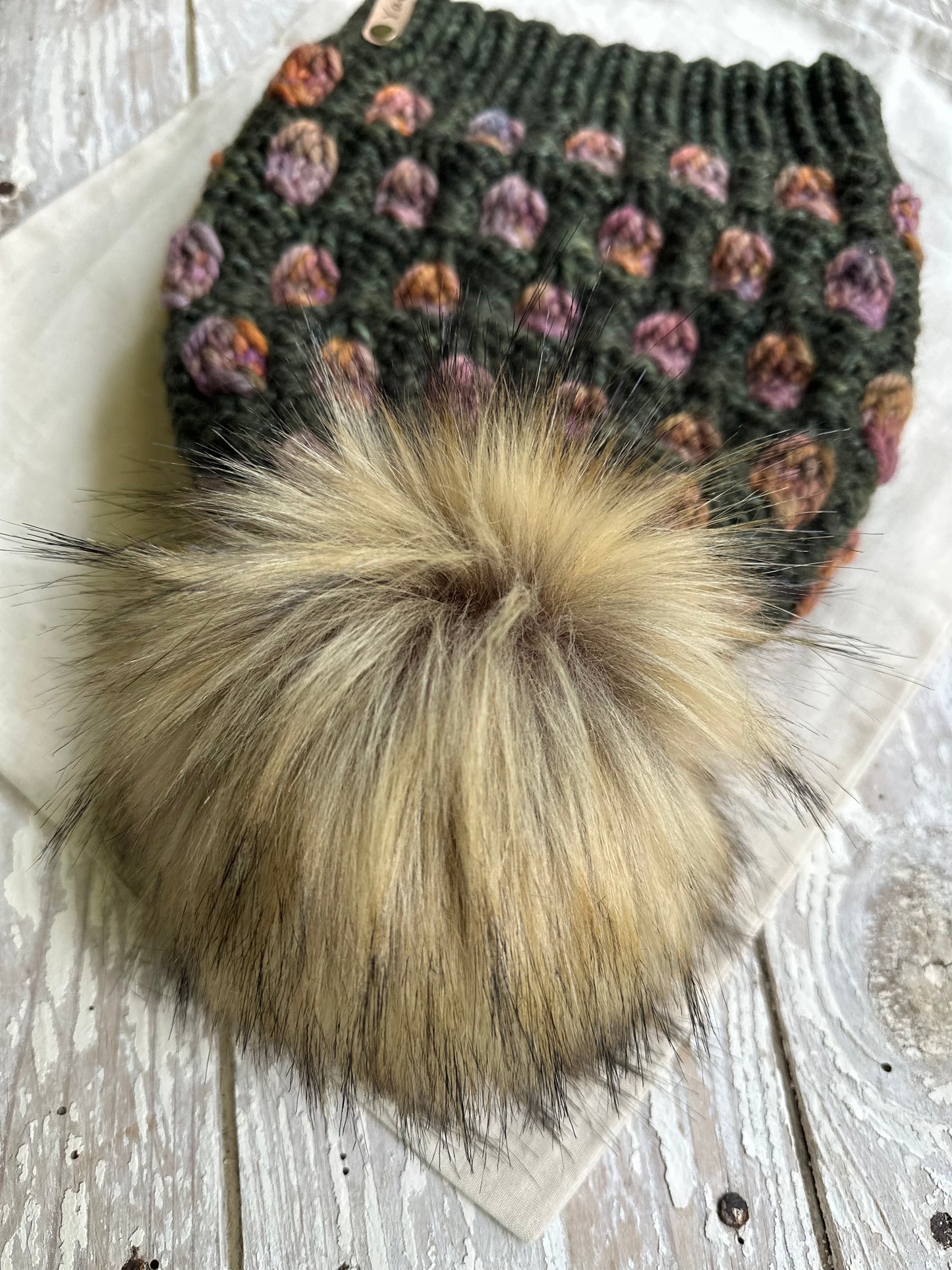 Slouchy Merino wool knit hat with faux fur pom