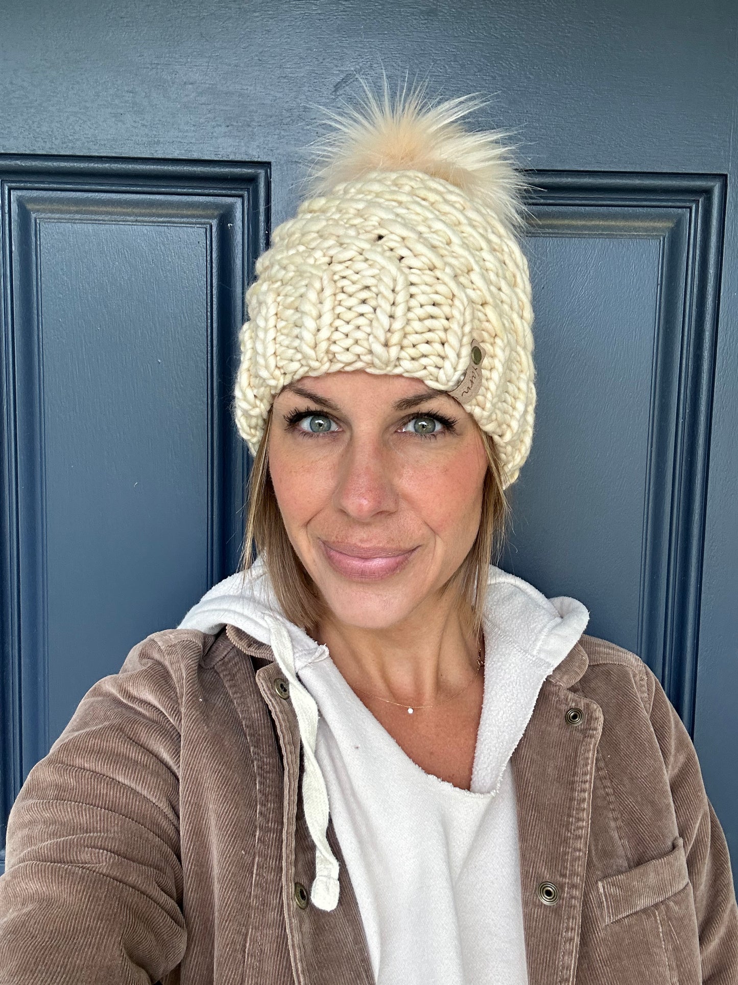 Merino wool knit hat with faux fur Pom