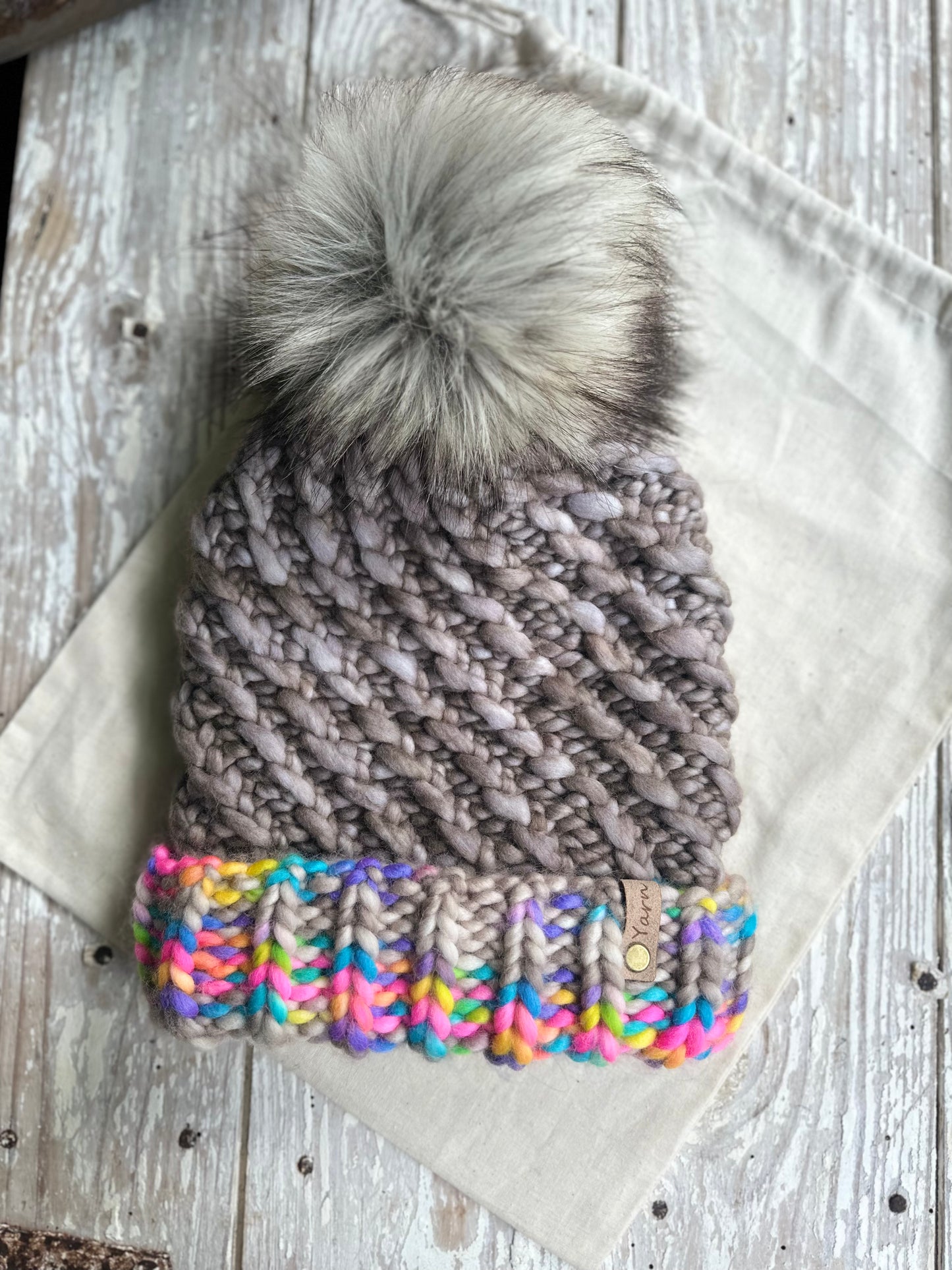 Merino wool folded brim knit hat with faux fur Pom