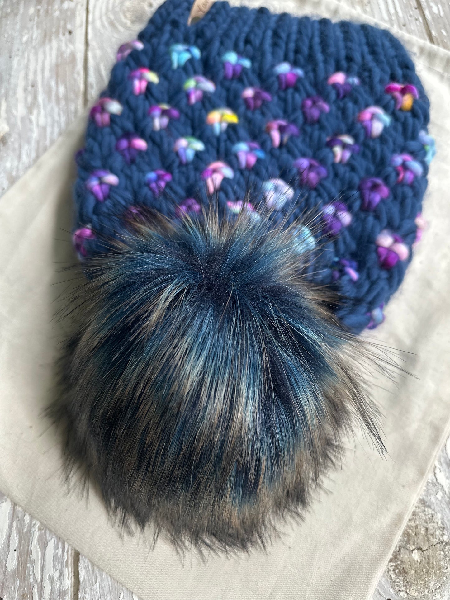 Merino wool knit hat with faux fur pom