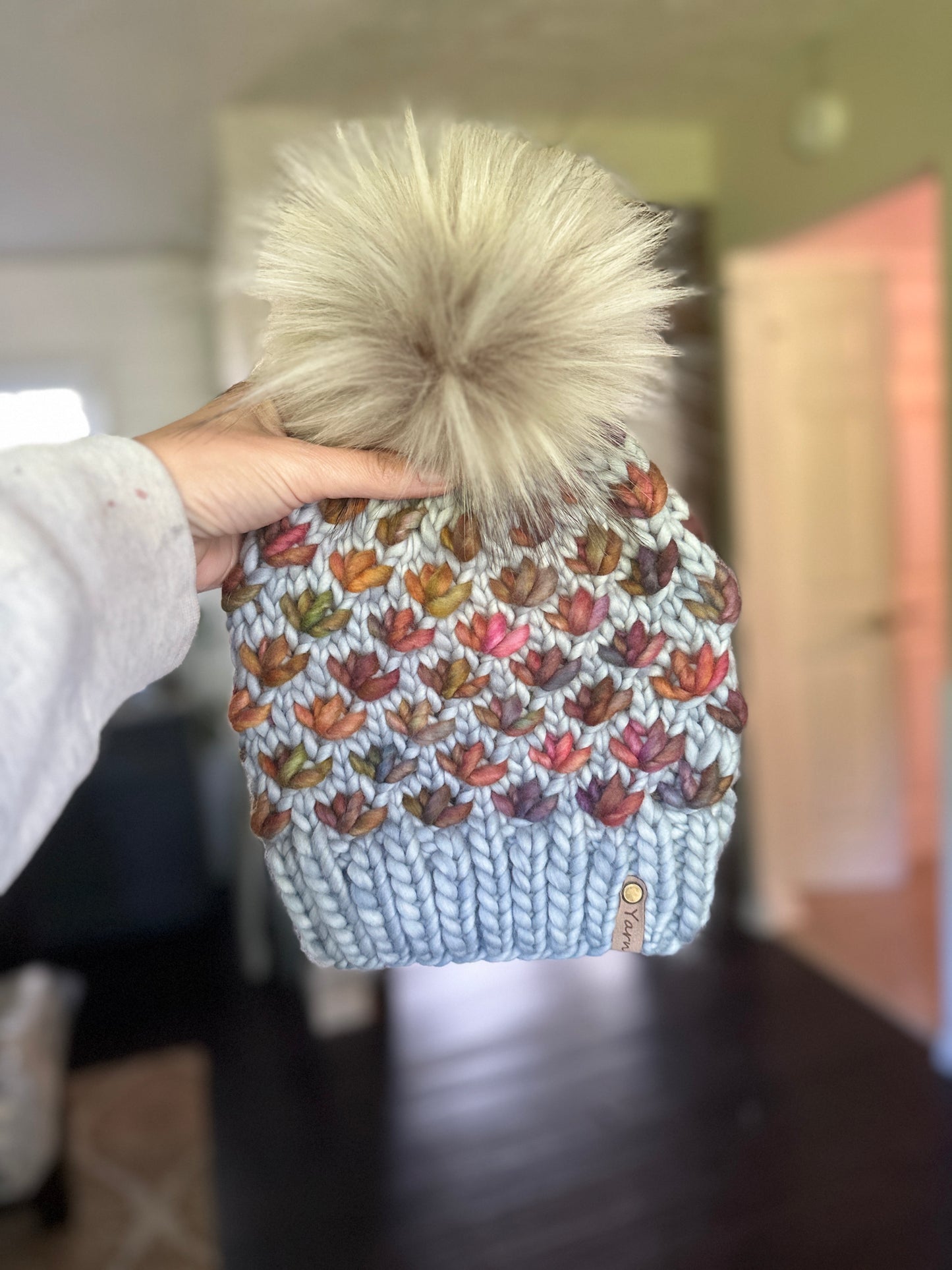 Merino wool knit hat with faux fur pom