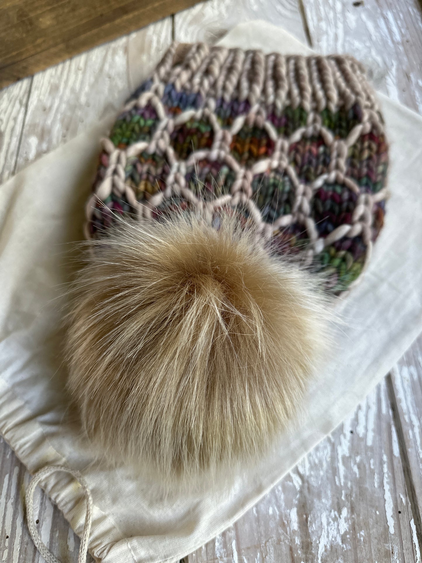 Merino wool knit hat with faux fur Pom