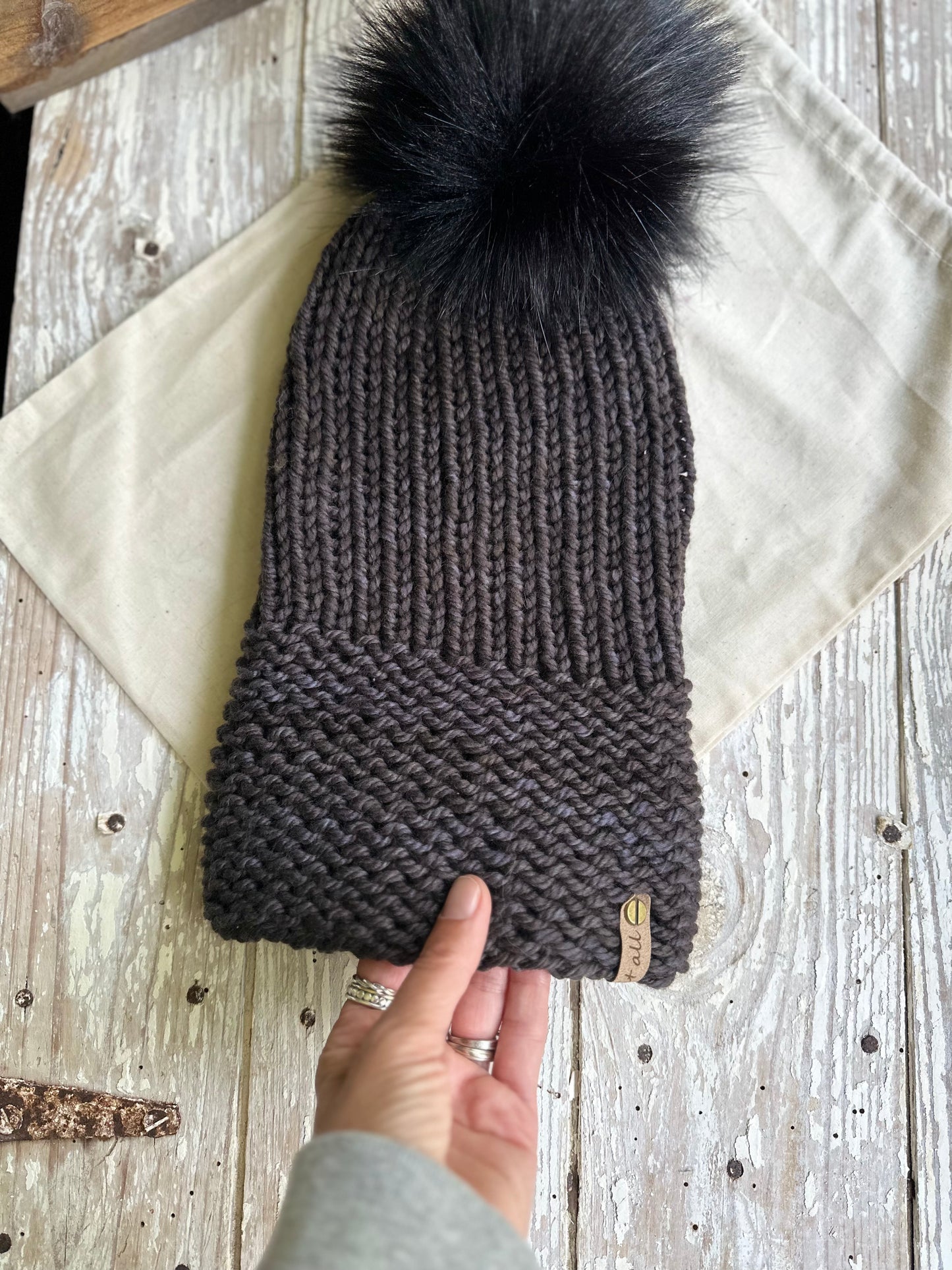 Merino wool knit folded brim beanie with faux fur Pom