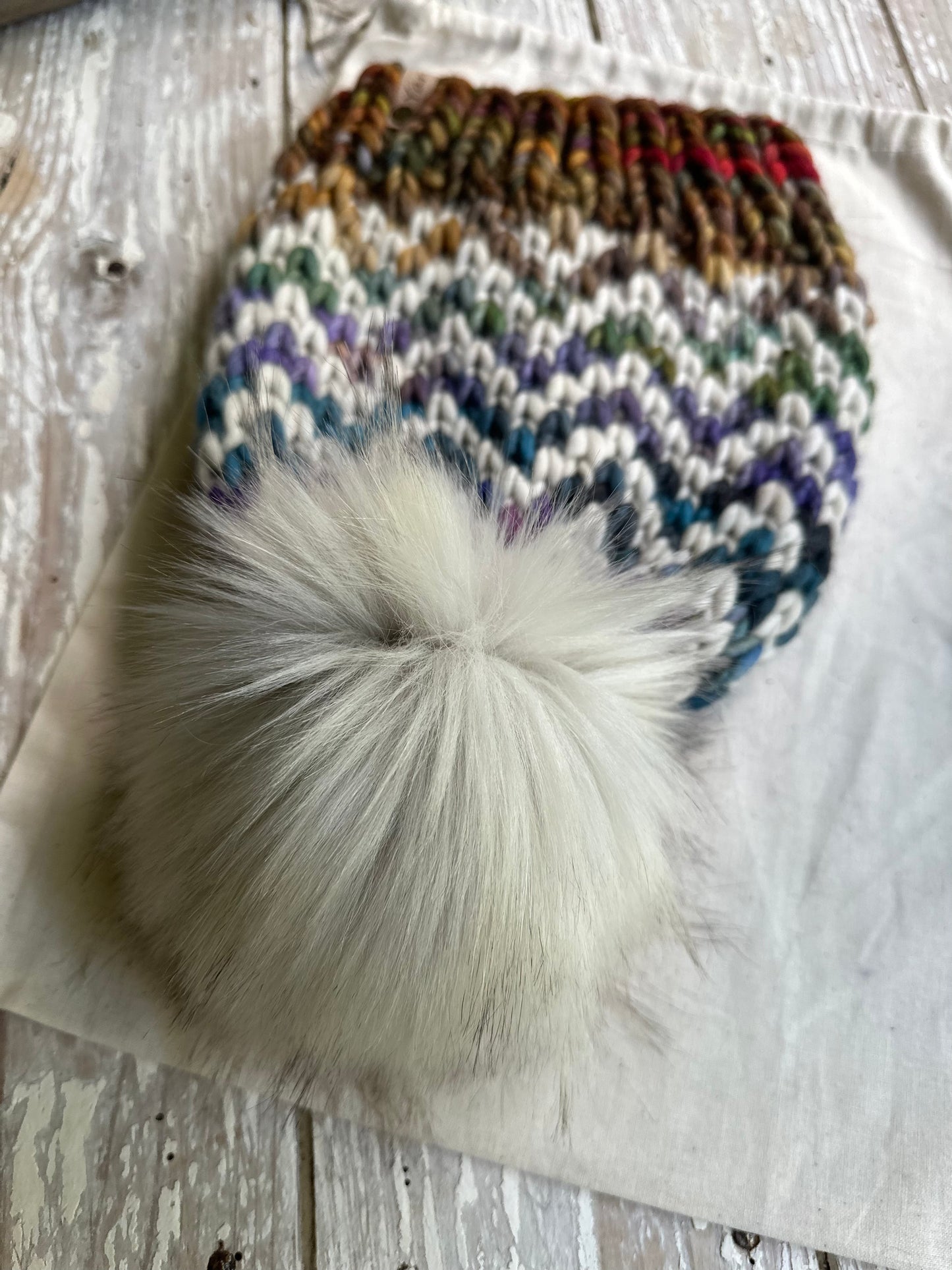 Merino wool knit hat with faux fur Pom