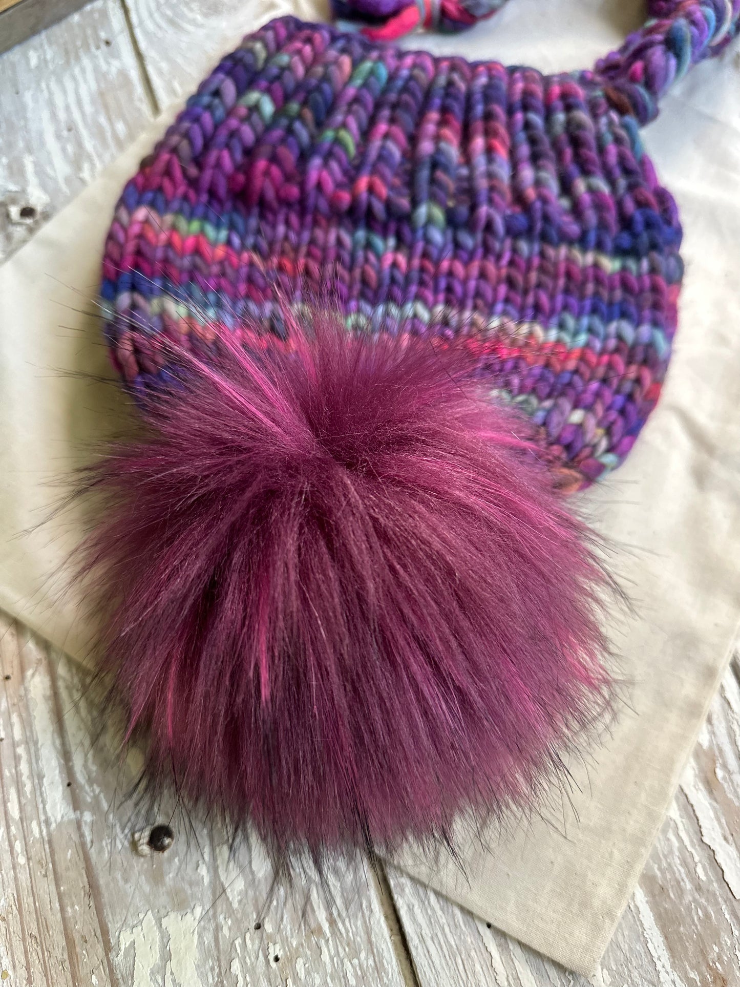 Merino wool split brim beanie with faux fur pom