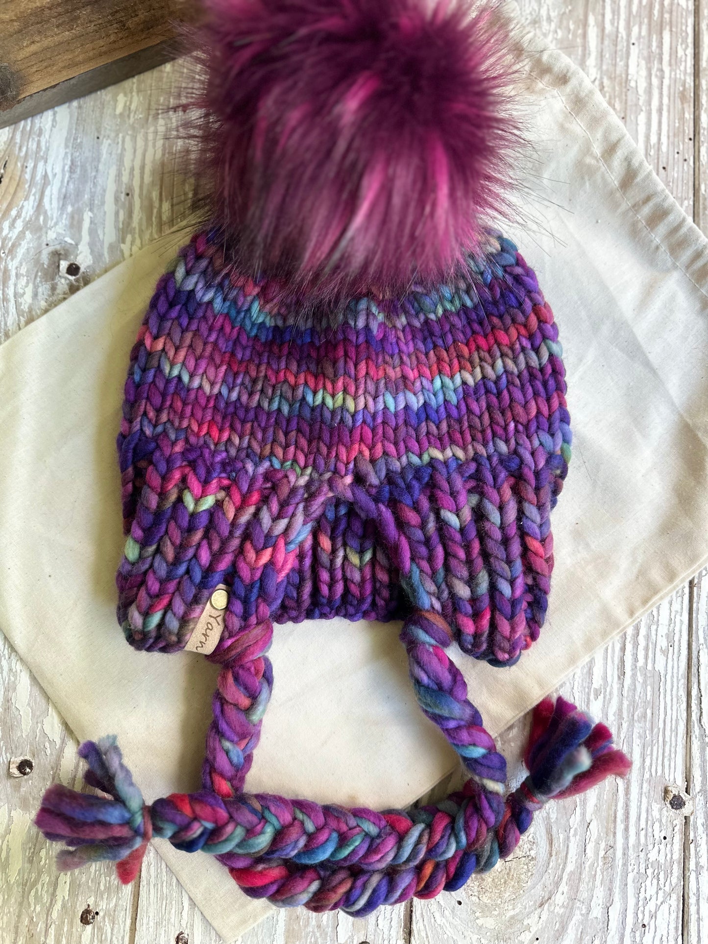 Merino wool split brim beanie with faux fur pom