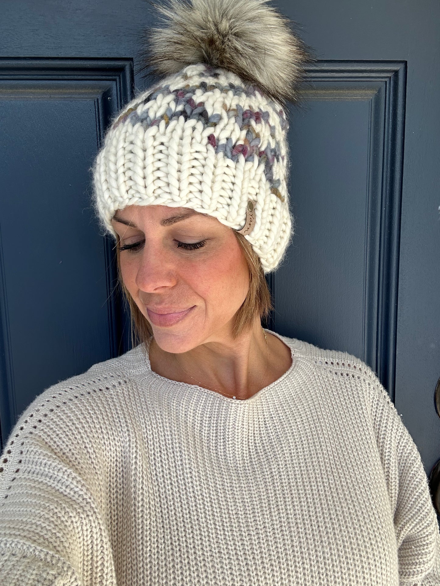 Merino wool knit hat with faux fur Pom