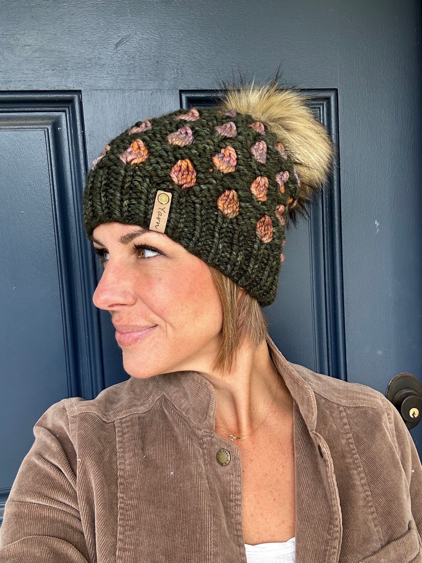 Slouchy Merino wool knit hat with faux fur pom