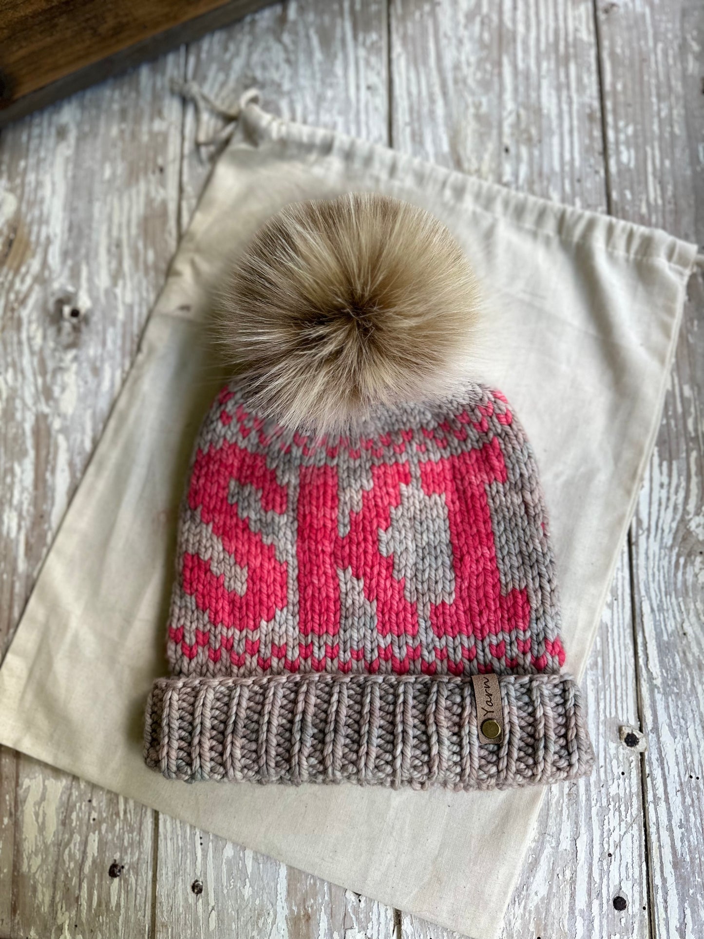 Merino wool folded brim knit hat with faux fur Pom