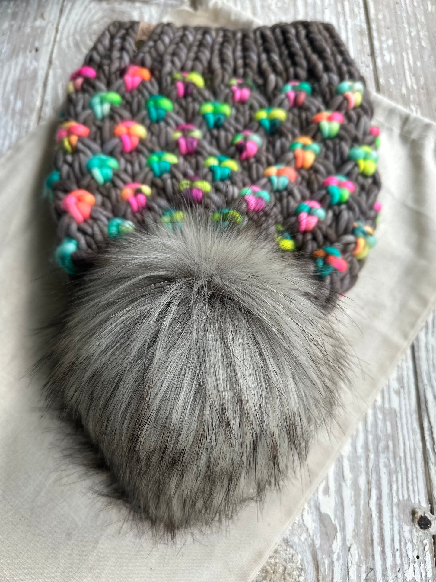 Merino wool knit hat with faux fur pom