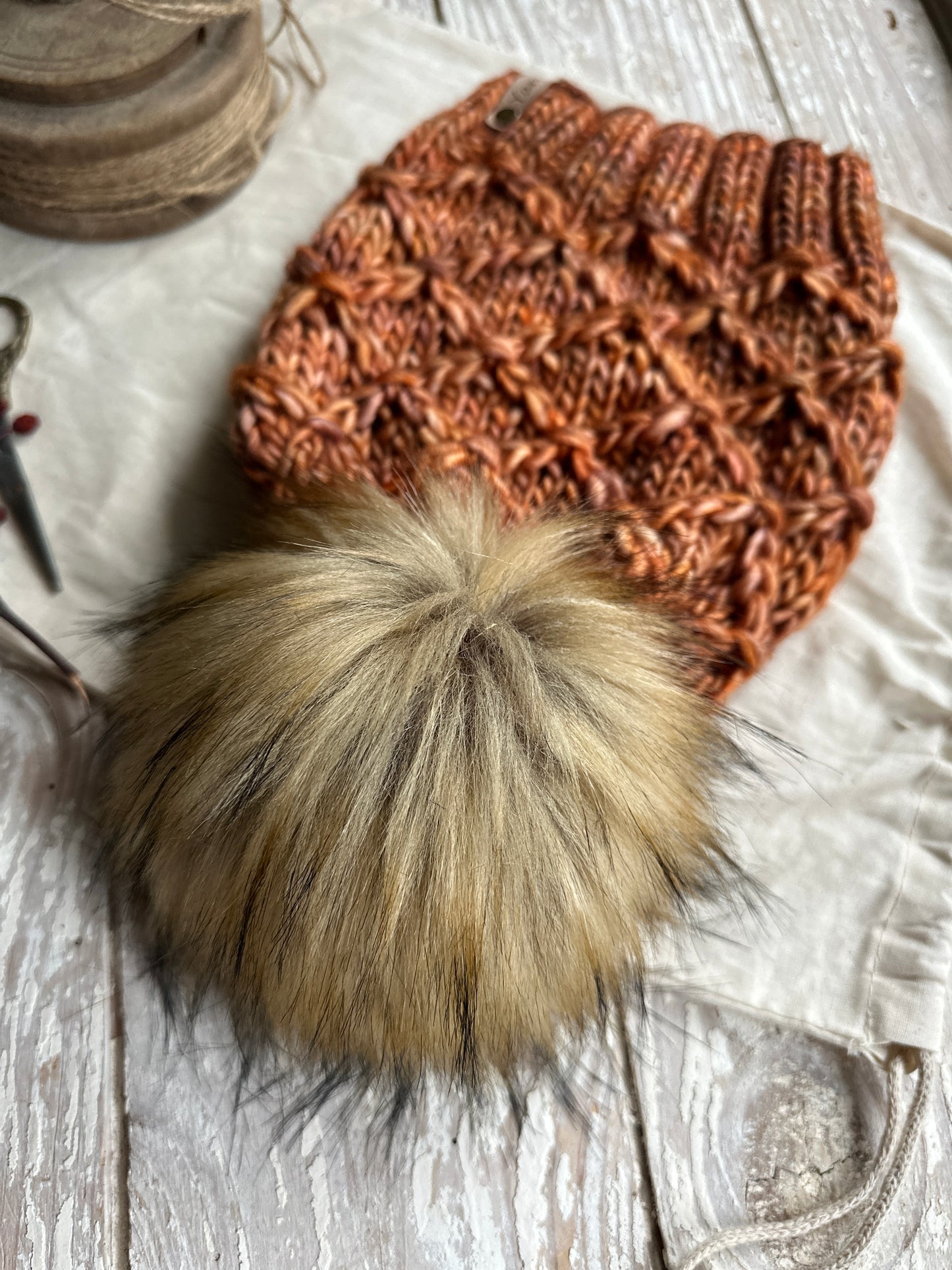 Merino wool knit hat with faux fur Pom