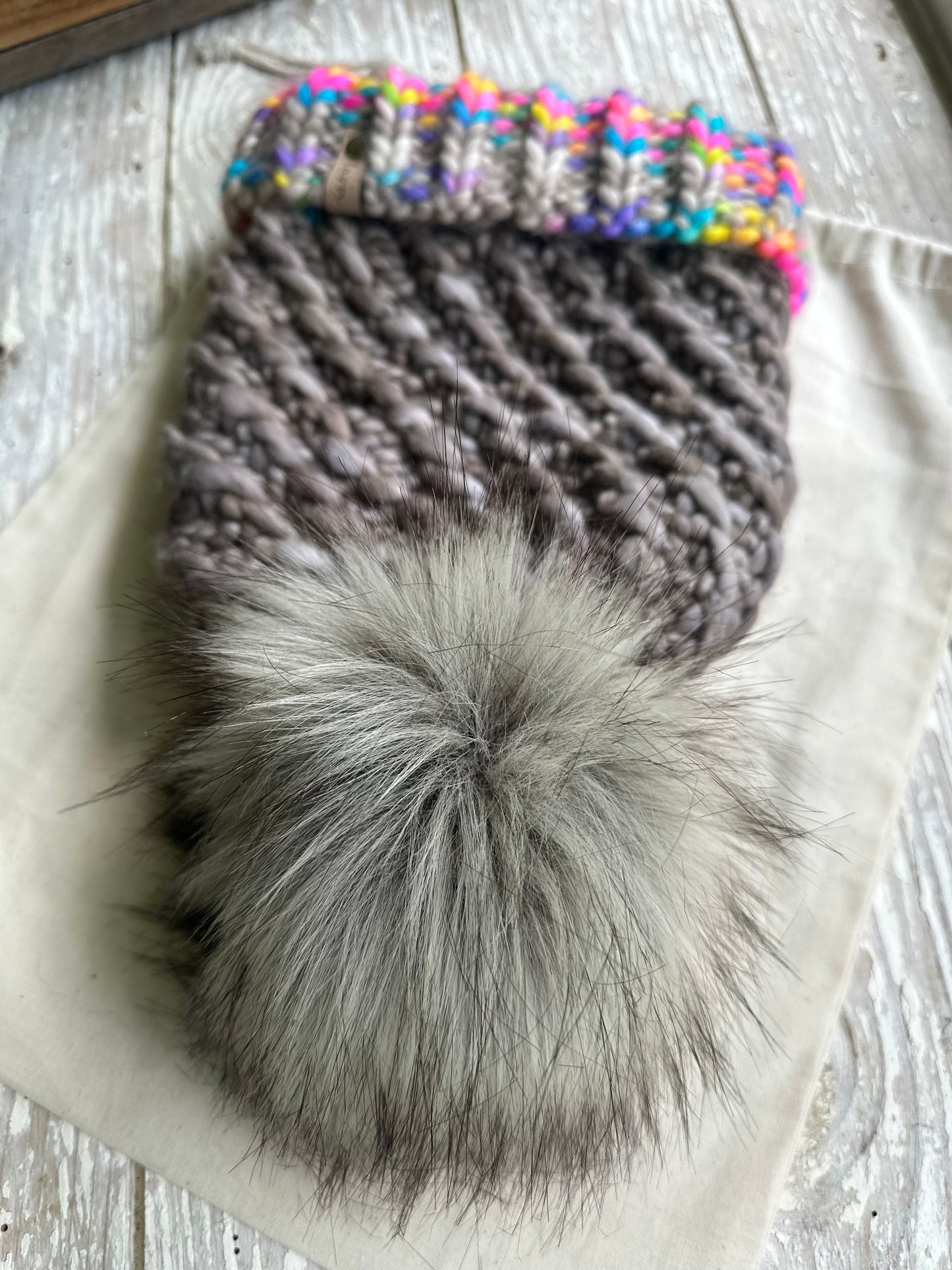 Merino wool folded brim knit hat with faux fur Pom