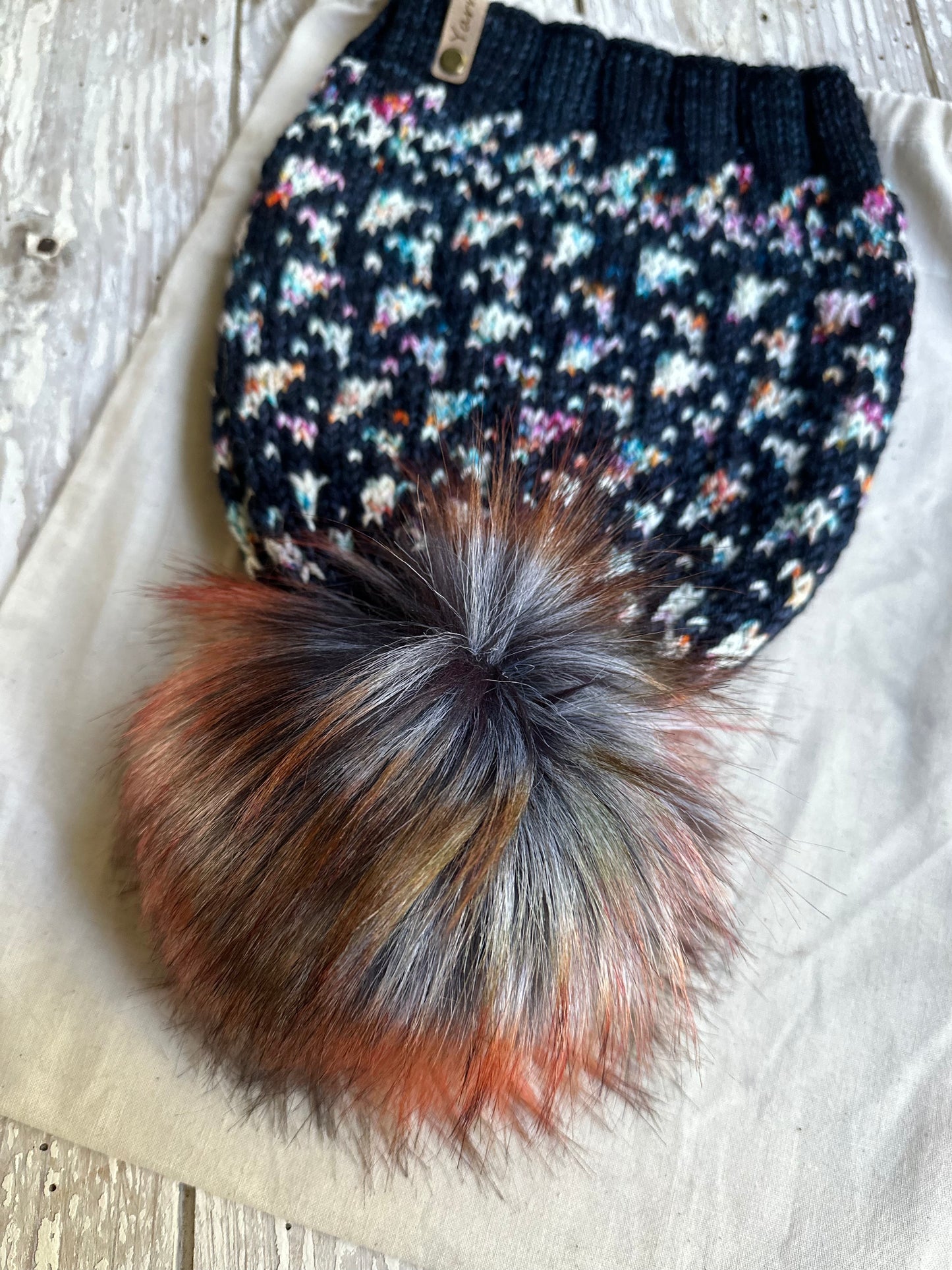 Merino wool knit hat with faux fur Pom