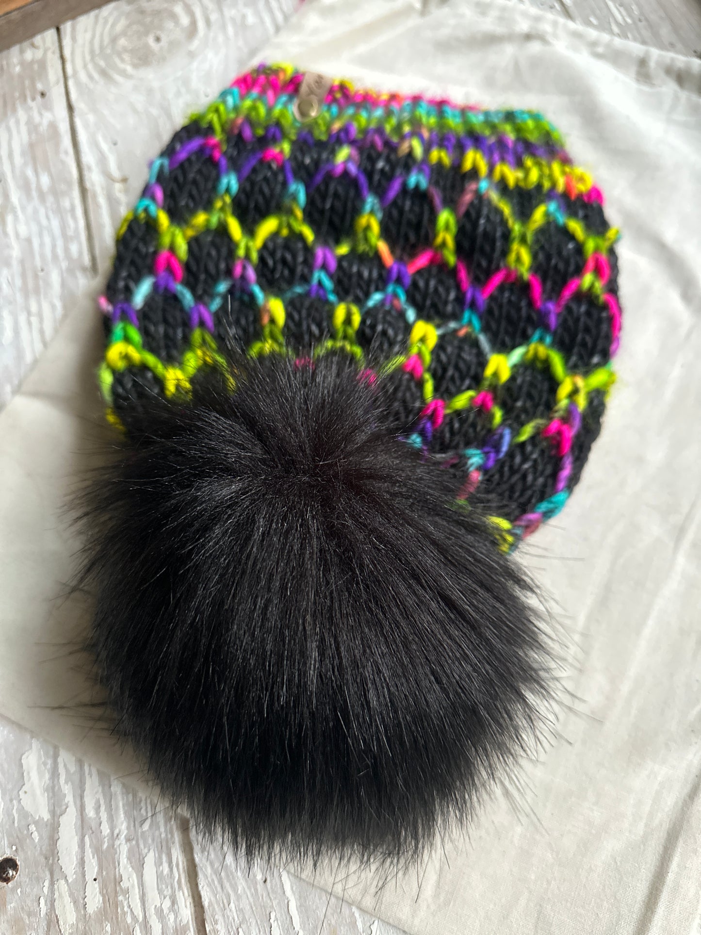 Merino wool knit hat with faux fur pom