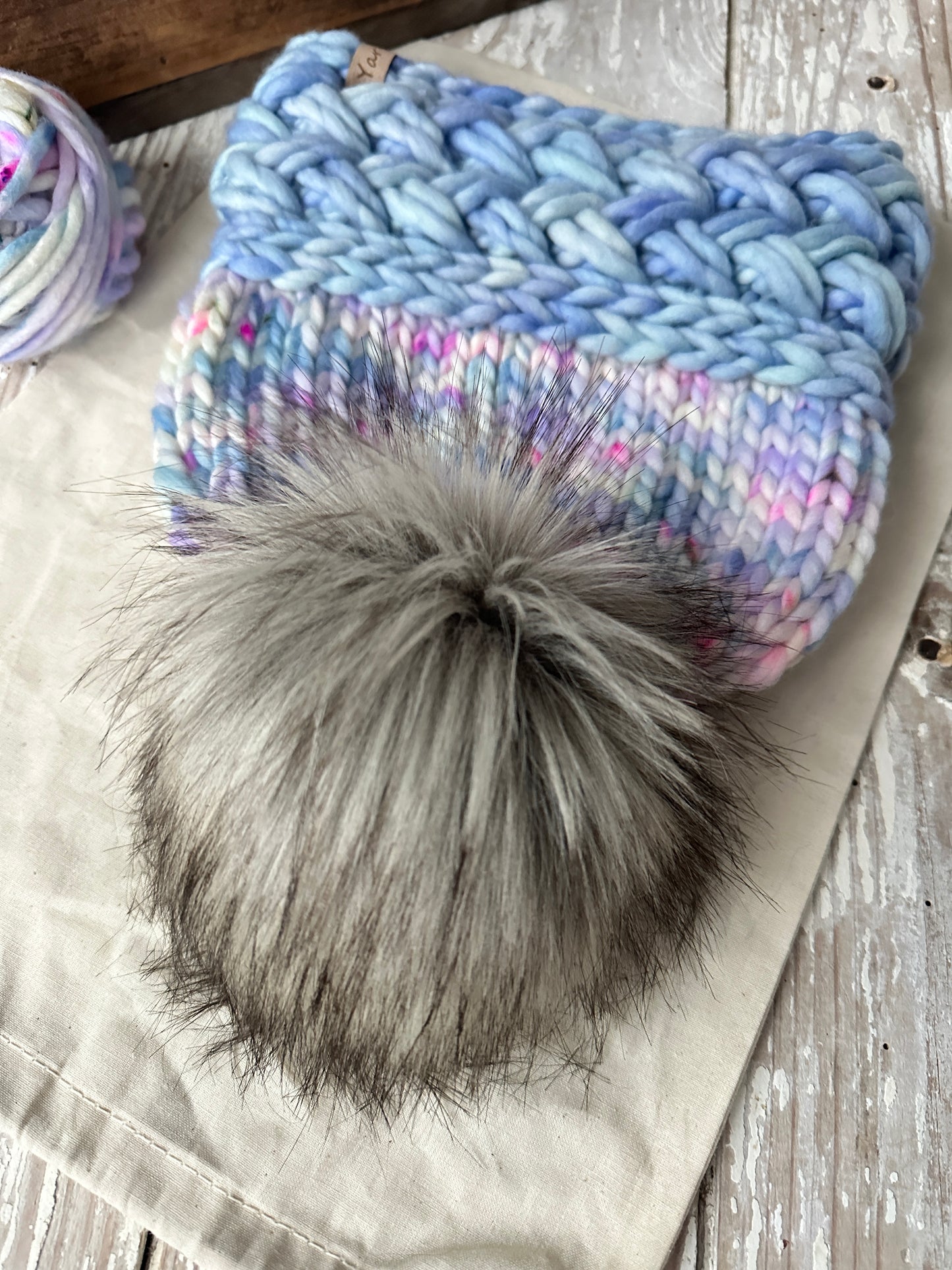 Merino wool knit hat with faux fur Pom