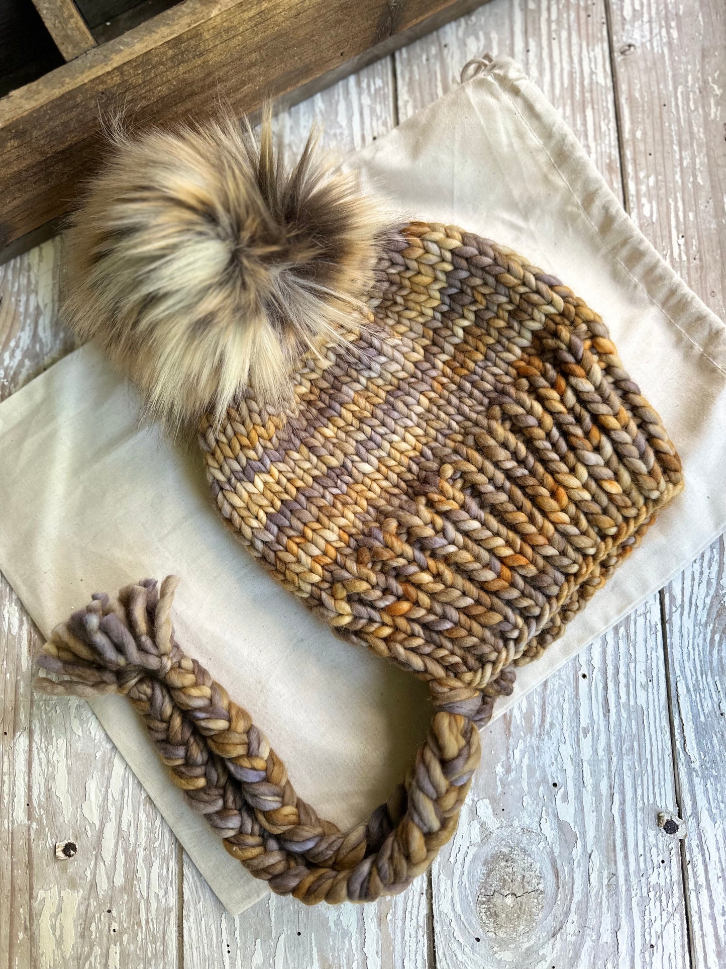 Merino wool split brim beanie with faux fur pom