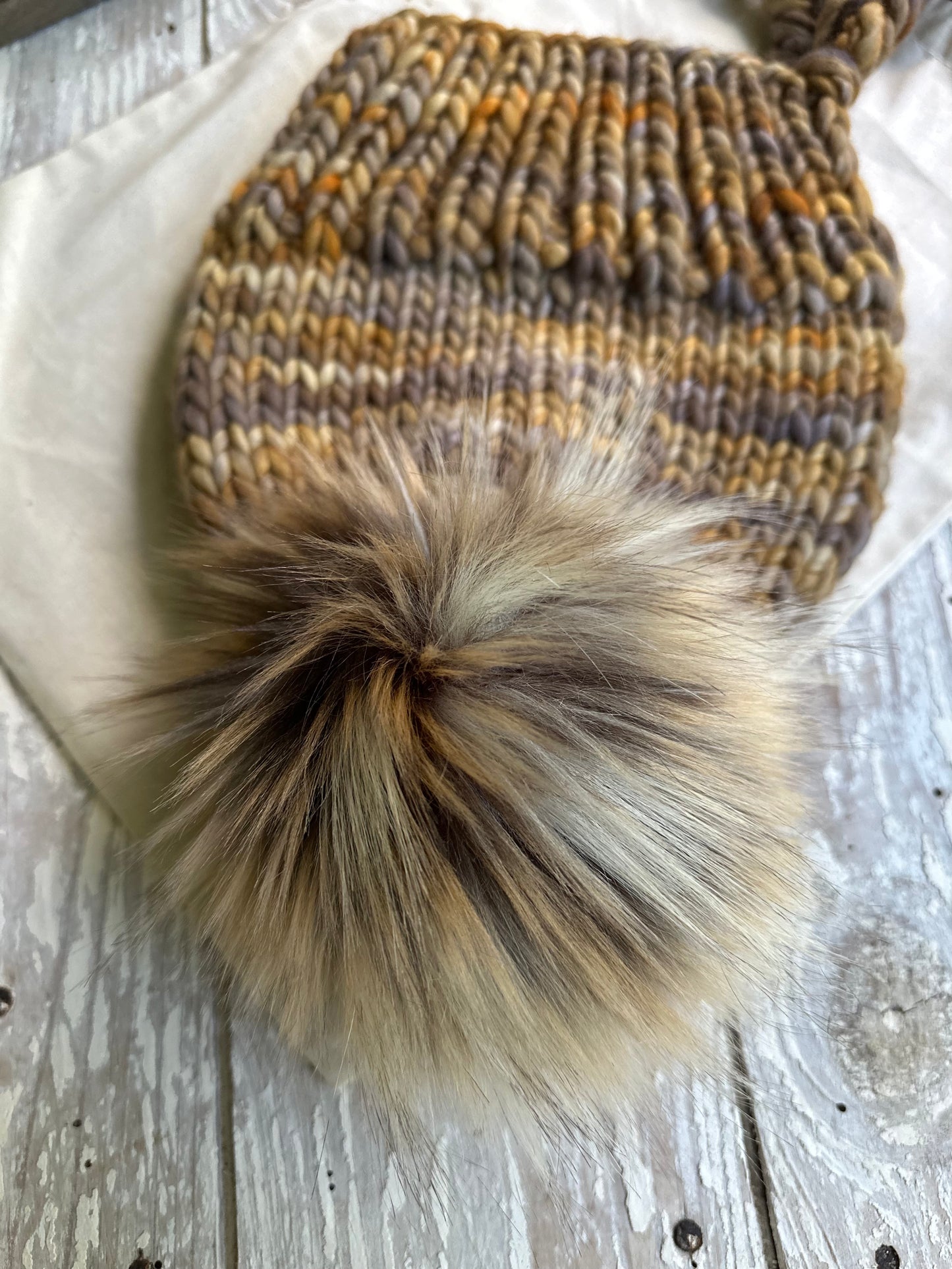 Merino wool split brim beanie with faux fur pom