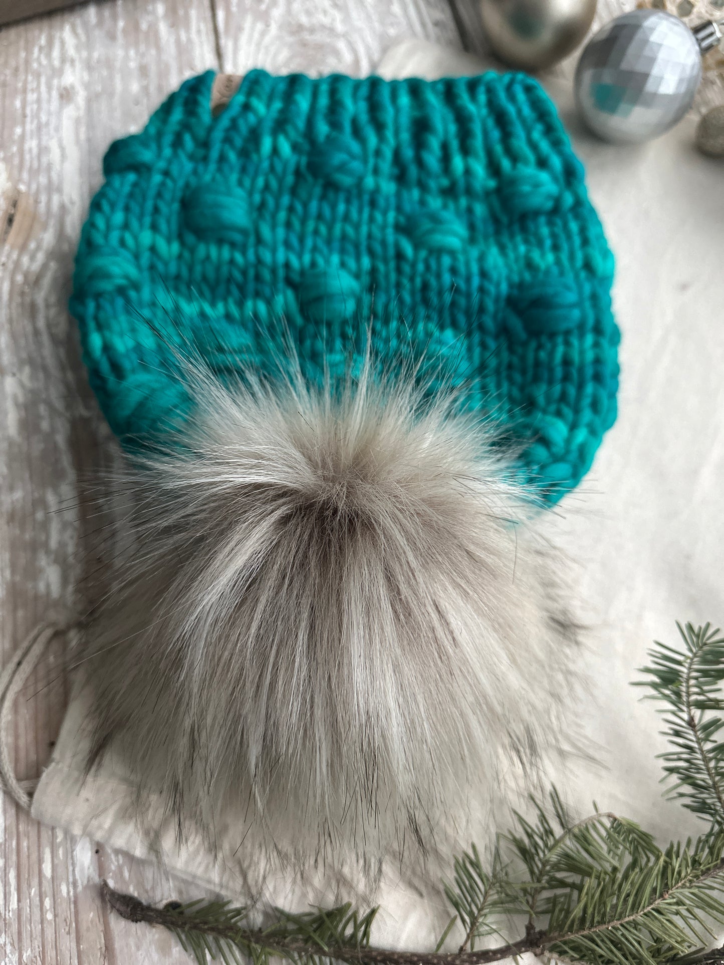 Merino wool knit hat with faux fur Pom