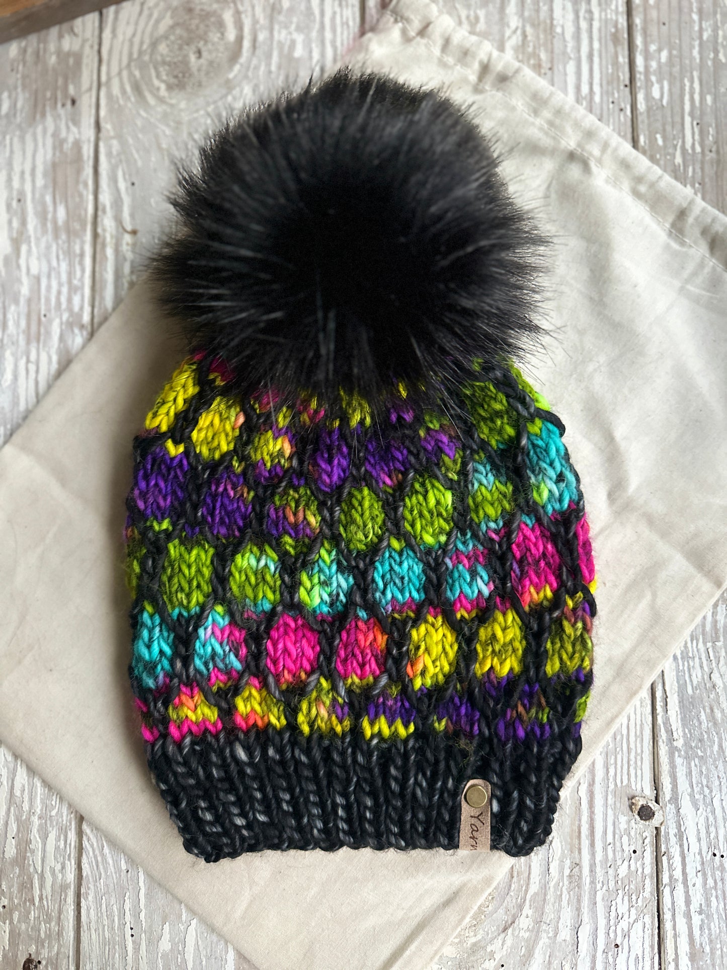 Merino wool knit hat with faux fur pom