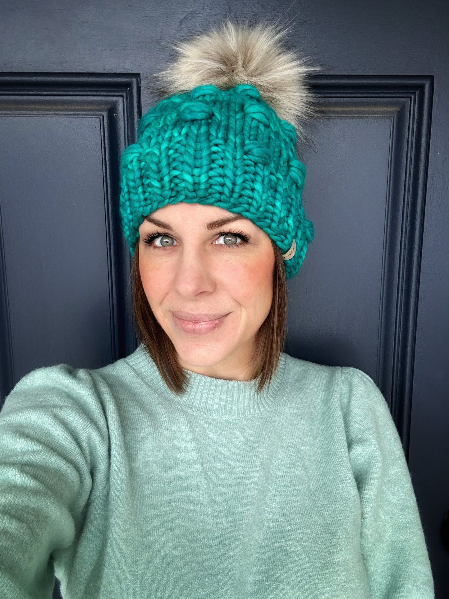 Merino wool knit hat with faux fur Pom