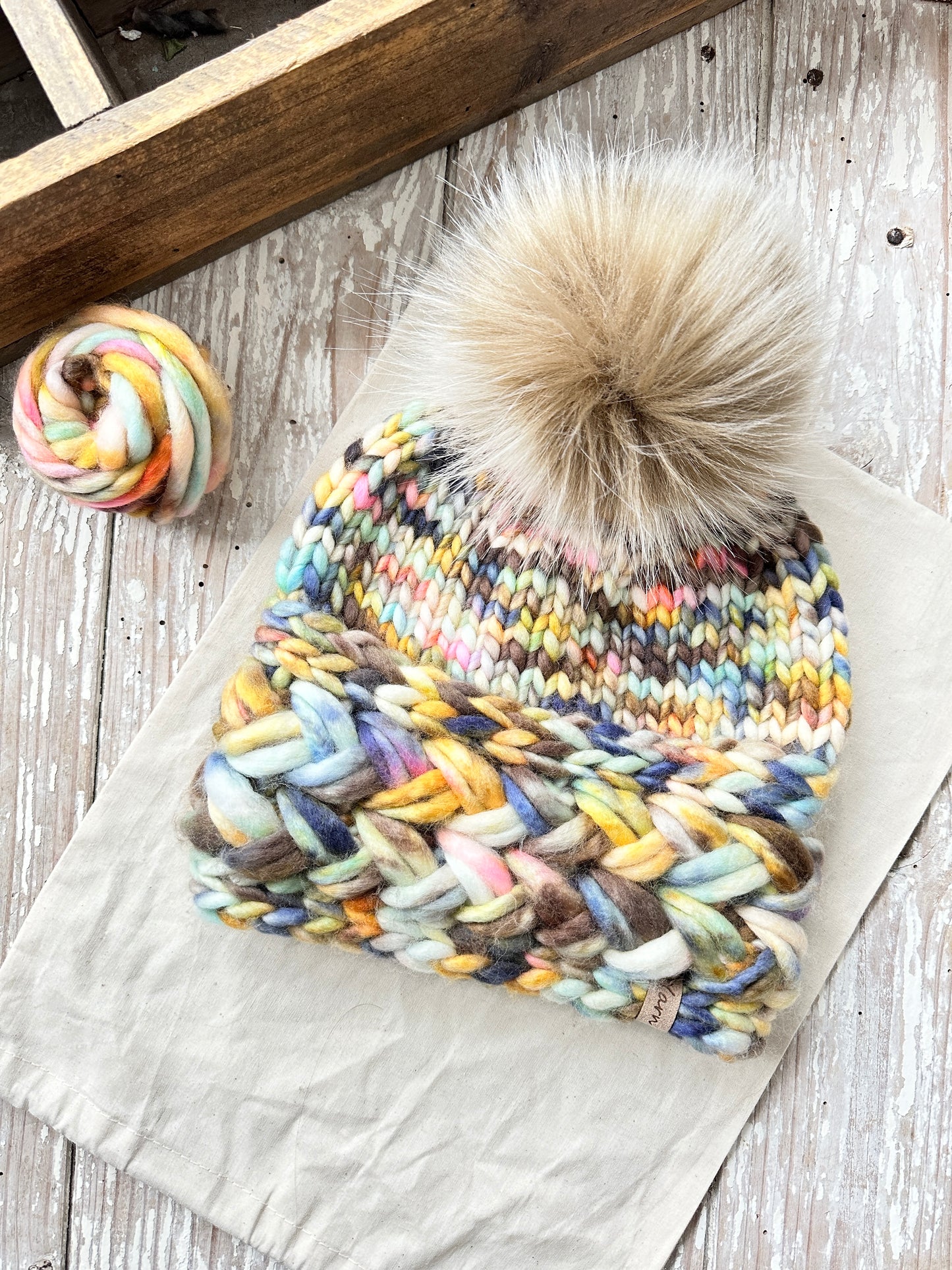 Merino wool knit hat with faux fur Pom