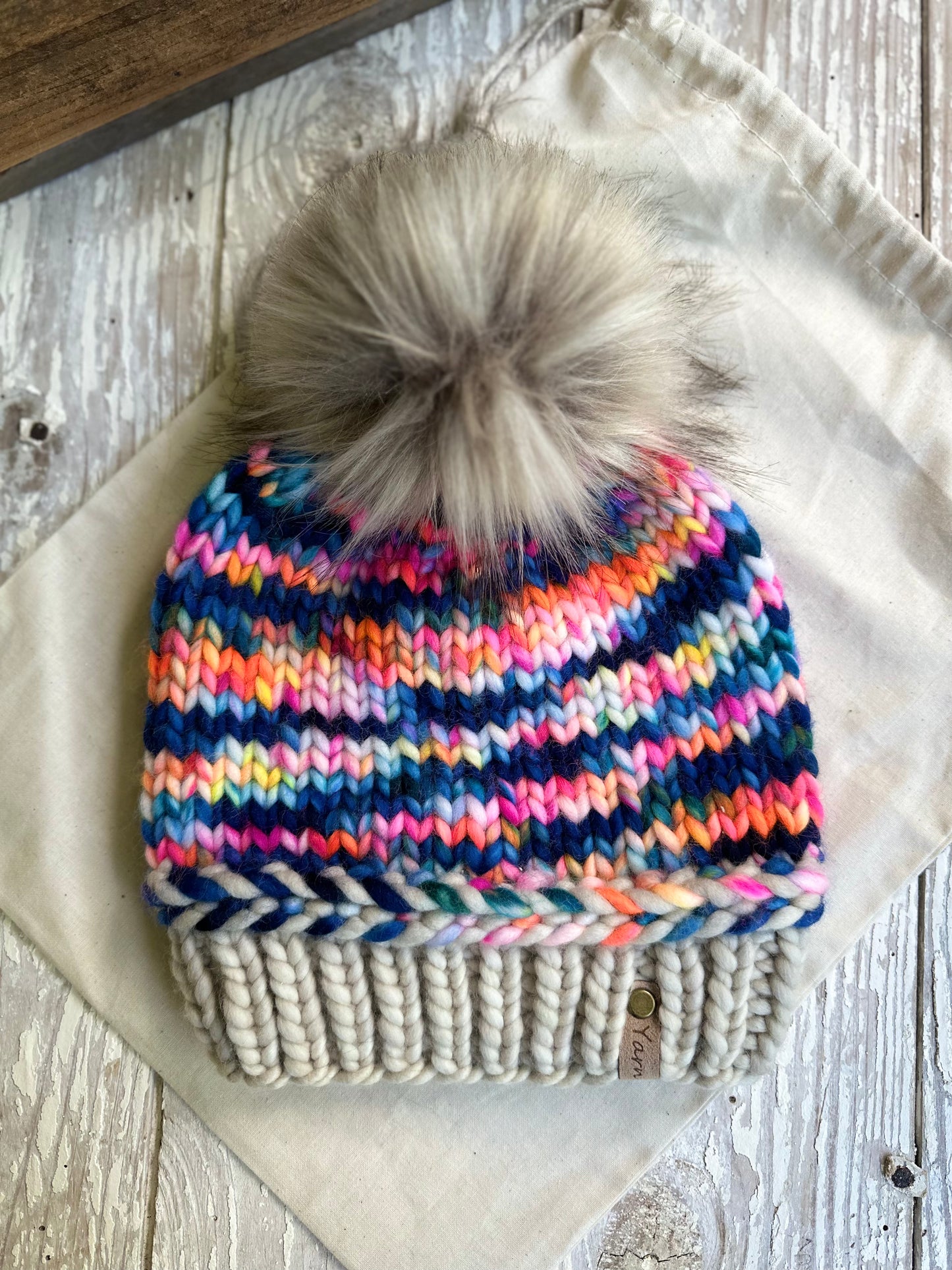 Merino wool knit hat with faux fur Pom