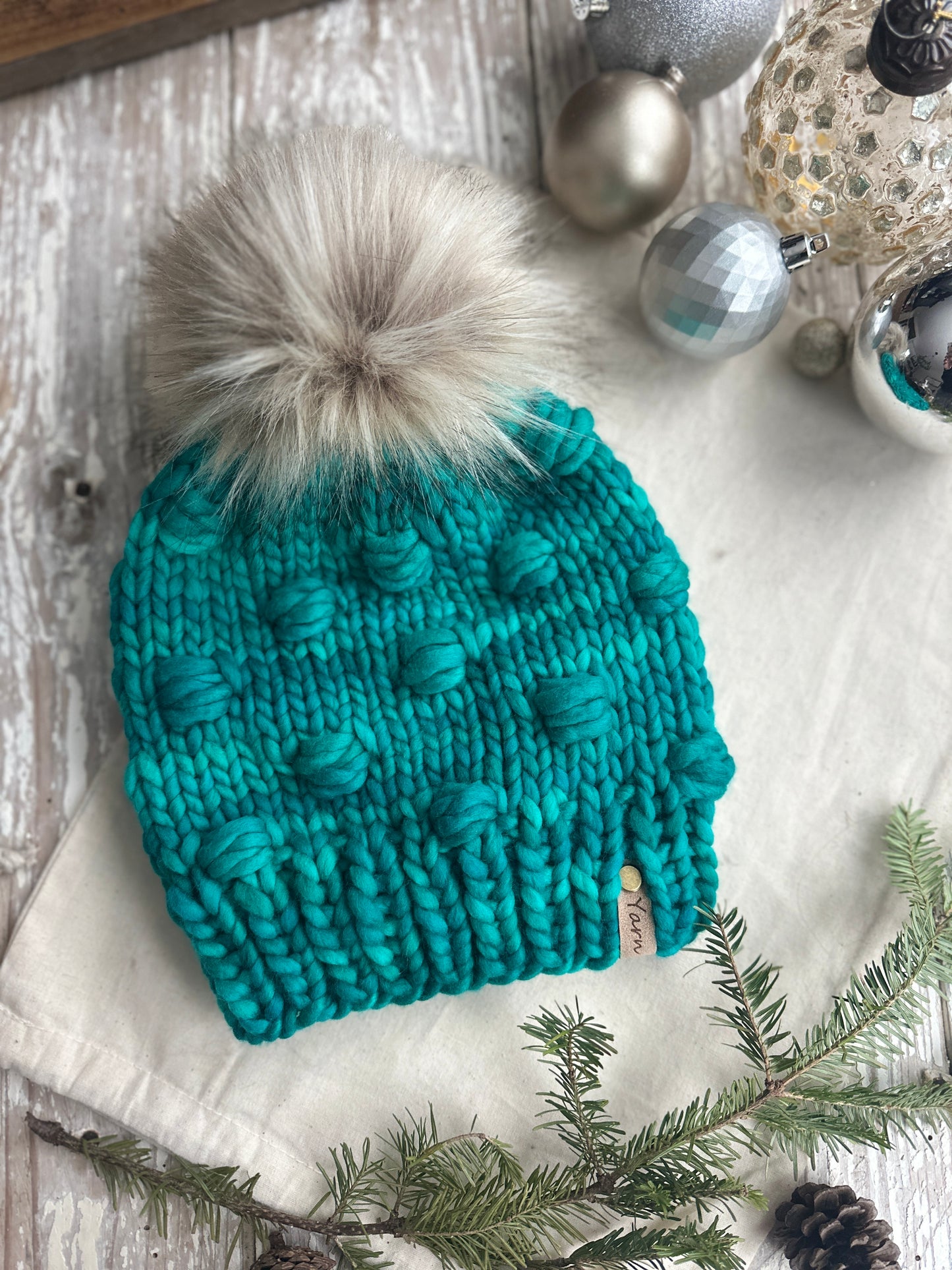 Merino wool knit hat with faux fur Pom