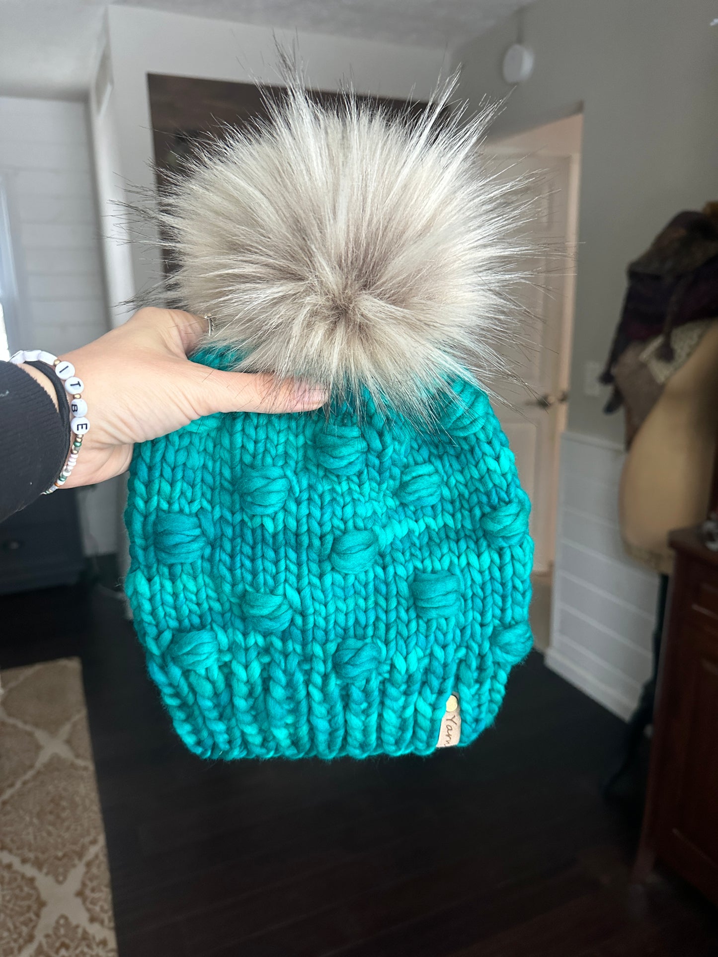 Merino wool knit hat with faux fur Pom