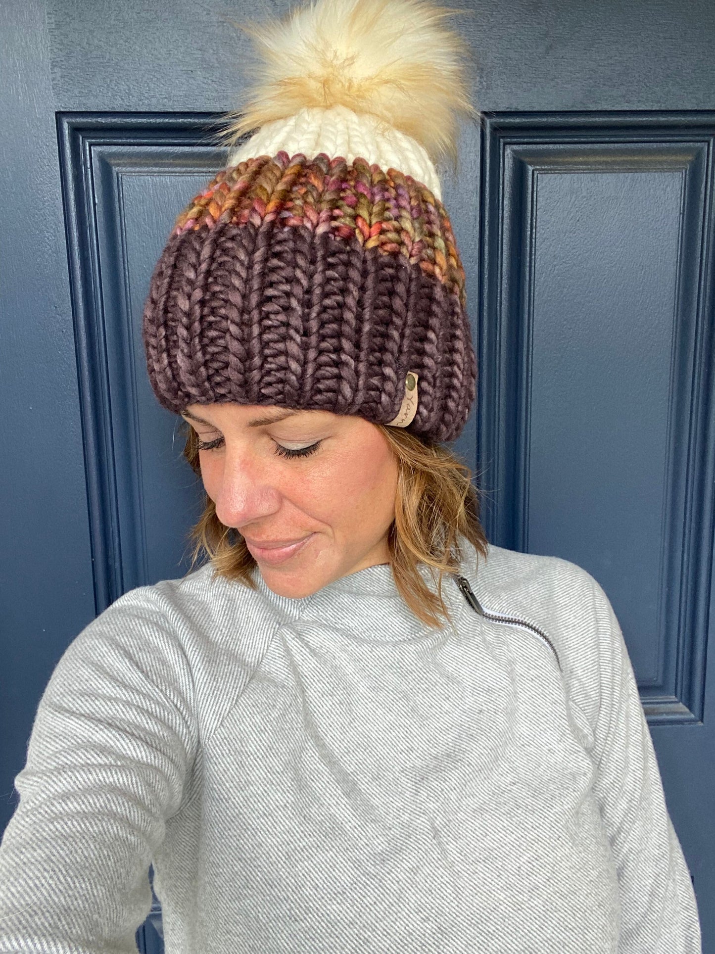 Merino wool knit hat with faux fur Pom