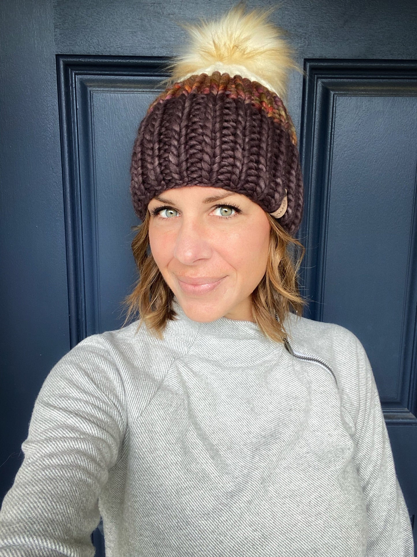 Merino wool knit hat with faux fur Pom